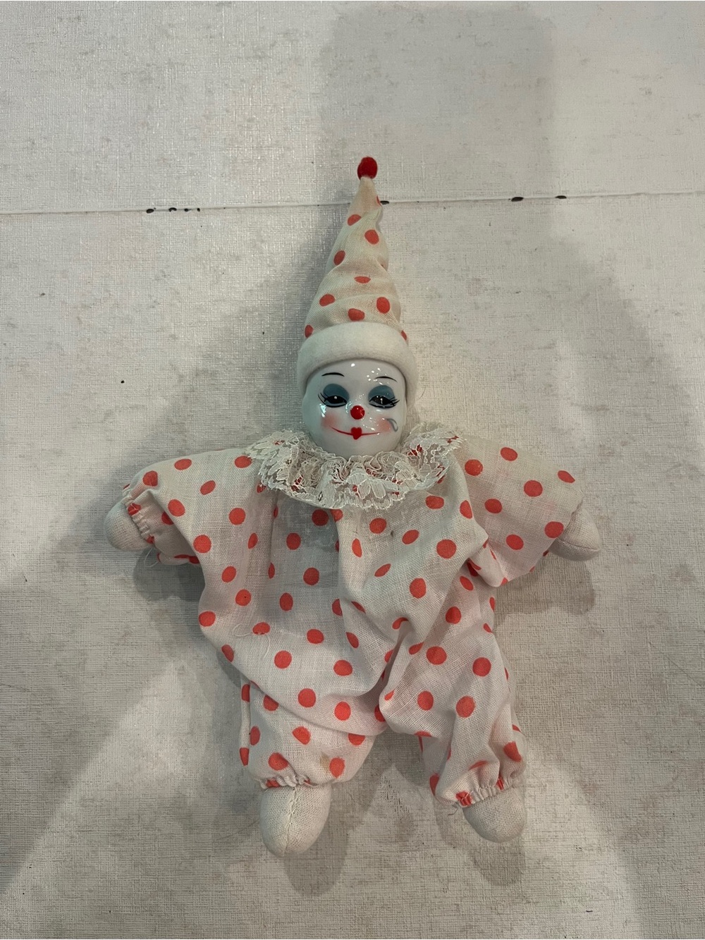 Vintage hand painted Porcelain clown in pink polka dot jester suit. So cute!